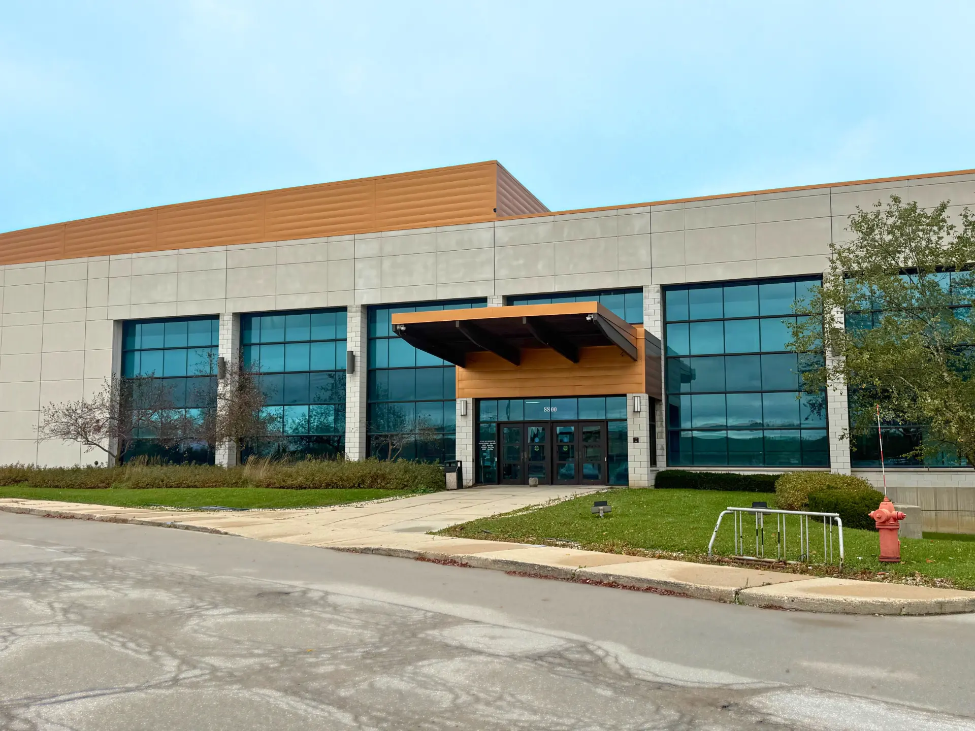 Front of the Salam Fitness & Aquatics building with copper canopy entrance
